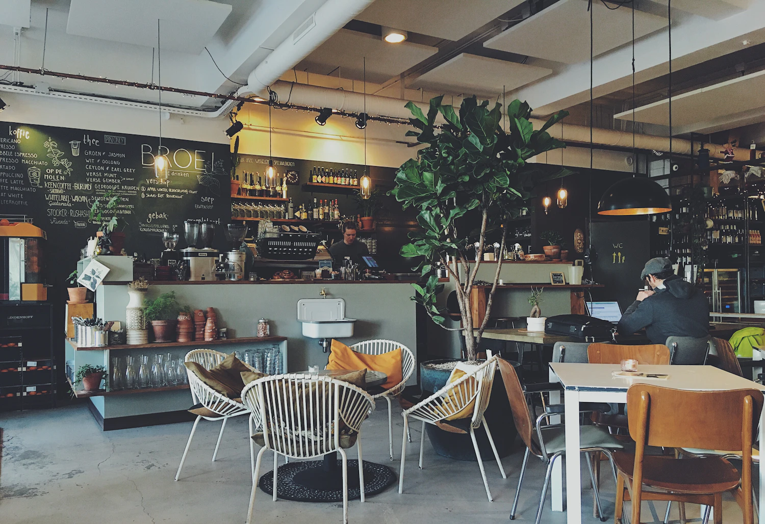 A warm neighborhood café with a welcoming counter and seating